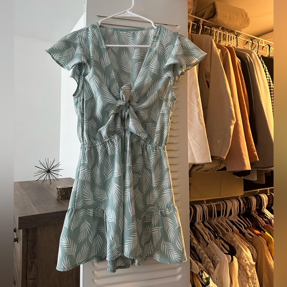 Gently worn green romper with floral detail from Aria Rose